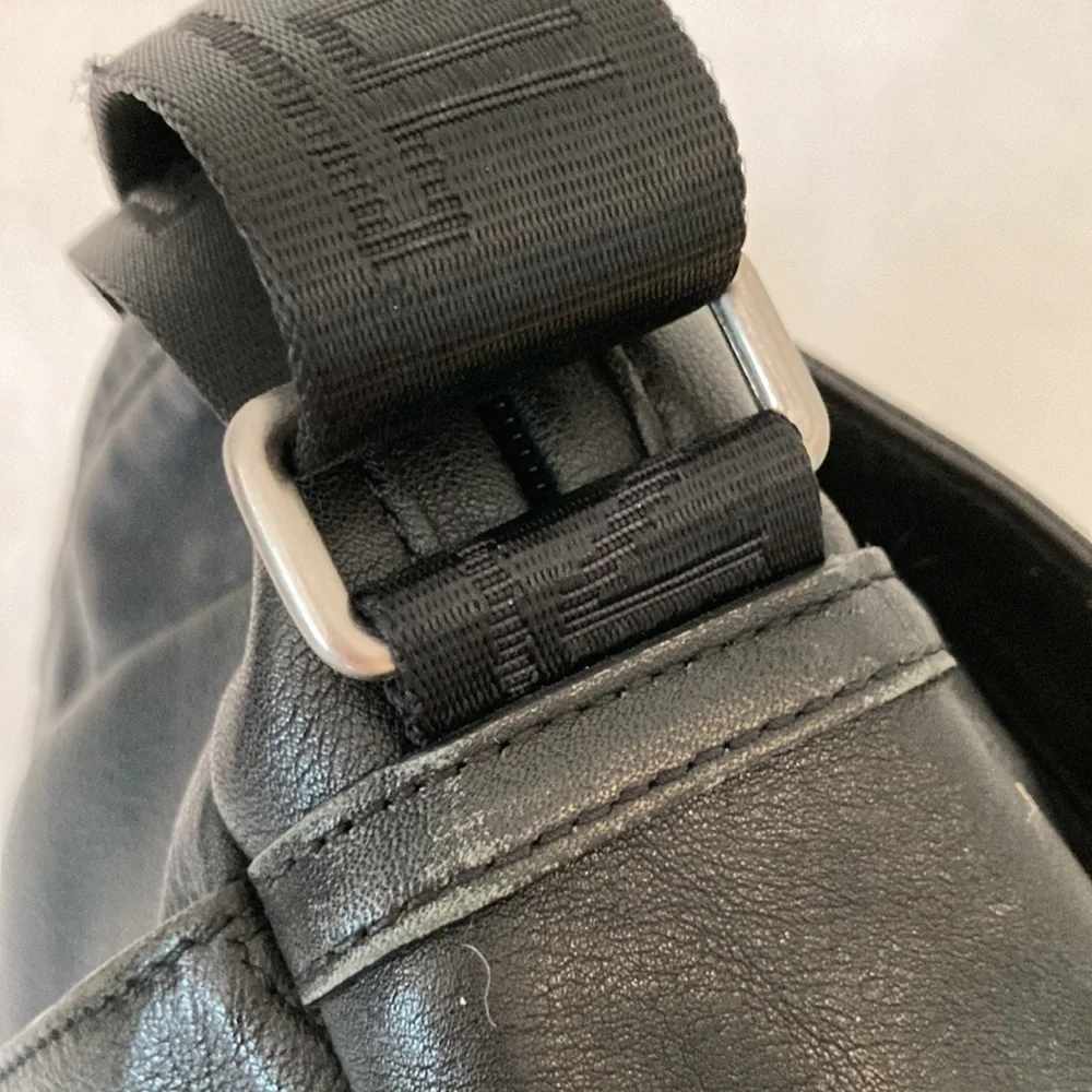 Tumi leather messenger tech lots of pockets